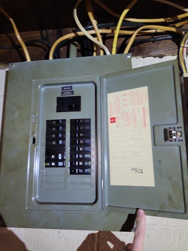 Conducted site evaluation for Kohler generator installation, documenting existing gas meter configuration and electrical panel capacity. Inspected 200A service panel with approximately 10-12 breakers to determine available space for generator transfer switch integration. Gas meter assessment confirmed current service type for proper generator fuel supply planning.