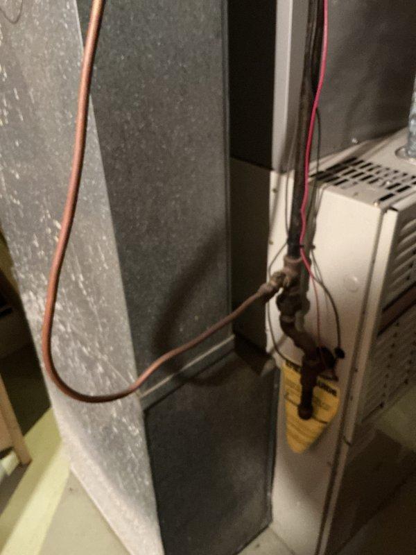 Inspected 30-year-old furnace in basement that was not heating due to failed heat exchanger and high limit switch. Documented existing HVAC system including Honeywell humidifier attachment and assessed condition of ductwork, wiring, and copper lines. Provided estimate for complete furnace replacement with options for AC and humidifier replacement.