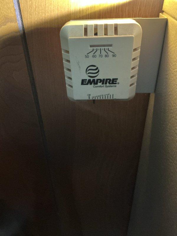 Responded to service call for a 12-year-old Empire Comfort Systems heating unit not providing adequate heat. Diagnostic testing revealed significantly low supply air temperature (23.6°F), indicating insufficient heat production. Performed system inspection, cleaned components, and adjusted the wall-mounted manual thermostat for proper calibration. Unit now functioning within normal operating parameters with appropriate temperature output.