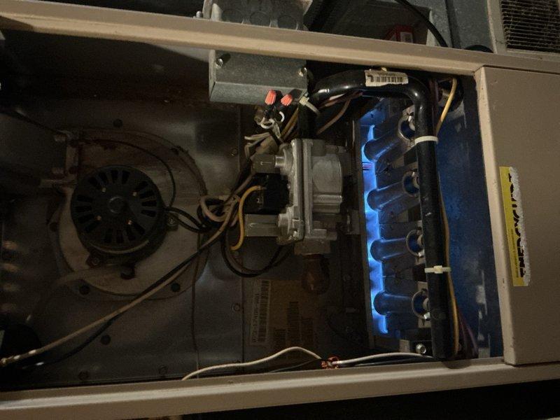 Performed routine tune-up on gas furnace of undetermined age. Conducted combustion analysis using Fieldpiece digital meter to verify proper operation. Inspected burner assembly which displayed appropriate blue flame pattern, indicating efficient combustion and proper gas-air mixture. All components functioning normally with no issues detected.