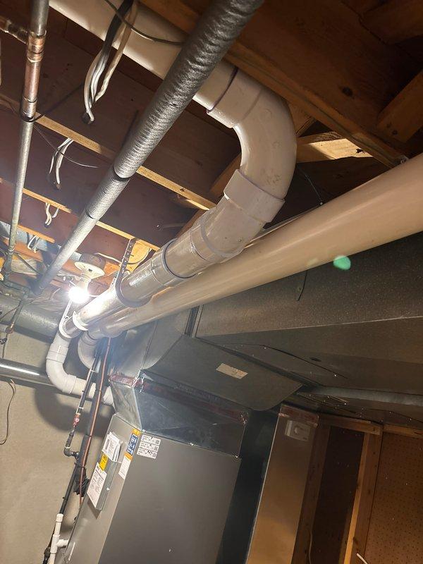 Completed installation of a complete HVAC system consisting of a 90,000 BTU furnace and 3.5-ton A/C unit with AHRI certification #215661534. Installation included 500m line set, system flush, extra filter, humidifier, and reconnection of existing components, with proper mechanical, plumbing, and electrical permits secured for the rear-mounted equipment.