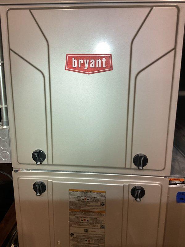 Completed Gold Furnace Inspection on 11-year-old Bryant forced air system located in basement. Unit is functioning properly with no visible damage or unusual wear. Also noted presence of Navien tankless water heater with Energy Star certification in good working condition with proper venting and plumbing connections.