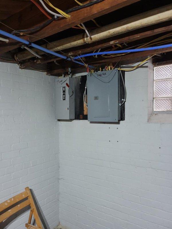 Conducted site assessment for installation of Unico Air Conditioning System in two-family flat with radiant heating. Property features wet plaster walls and decorative crown molding requiring specialized installation approach. Inspected electrical service panels in basement to evaluate capacity for new system, noting separate panel for second floor and documenting existing infrastructure to determine optimal equipment placement and routing.