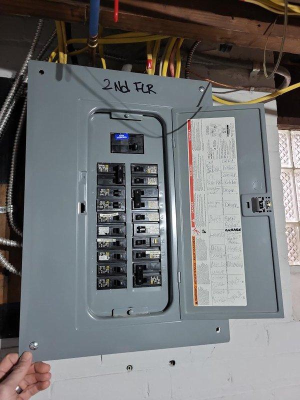 Conducted site assessment for installation of Unico Air Conditioning System in two-family flat with radiant heating. Property features wet plaster walls and decorative crown molding requiring specialized installation approach. Inspected electrical service panels in basement to evaluate capacity for new system, noting separate panel for second floor and documenting existing infrastructure to determine optimal equipment placement and routing.