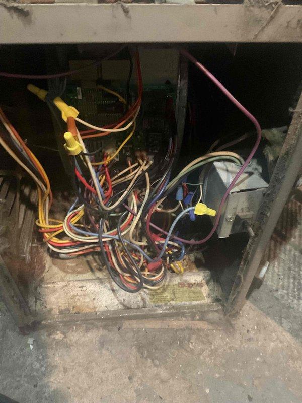 Performed routine tune-up on 10+ year old furnace located in basement. Inspection revealed significant dust accumulation on blower motor assembly and disorganized wiring connections to control board. Cleaned components, secured loose wiring, and verified proper system operation before completing service.