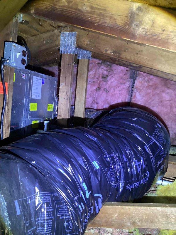 Conducted evaluation of 20-year-old HVAC system in attic showing refrigerant leak. Documented existing installation conditions including electrical connections, ductwork configuration, and limited attic access that will require special consideration during replacement. System currently operational but recommended replacement due to age and leak issues rather than repair.