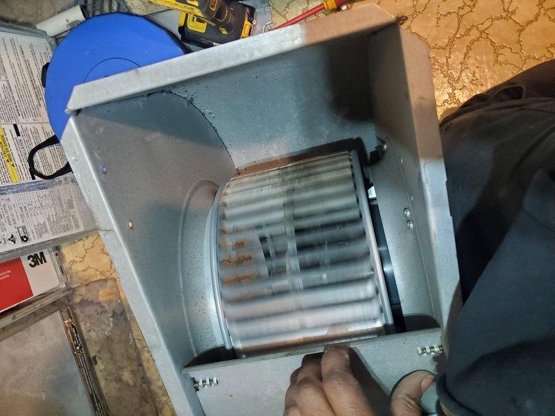 Performed diagnostic inspection on noisy furnace for new homeowner. Disassembled and examined blower assembly, finding signs of rust and wear on fan blades. Serviced and reassembled blower unit to reduce operational noise; system now functioning properly with normal sound levels.