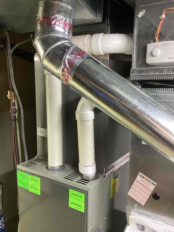 Responded to no-heat emergency involving a 15-year-old furnace requiring extensive repairs. After thorough inspection of the basement-located unit, determined replacement was more cost-effective than repair. Installed new HVAC system with proper ductwork connections and drainage piping, confirmed by multiple inspection approvals as evidenced by certification stickers.