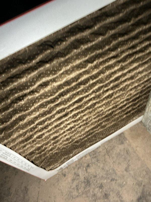 Responded to service call for non-operational Goodman electric furnace (approximately 2 years old). Diagnostic inspection revealed severely clogged air filter causing system restriction and shutdown. Replaced filter and restored proper airflow, returning furnace to normal operation.