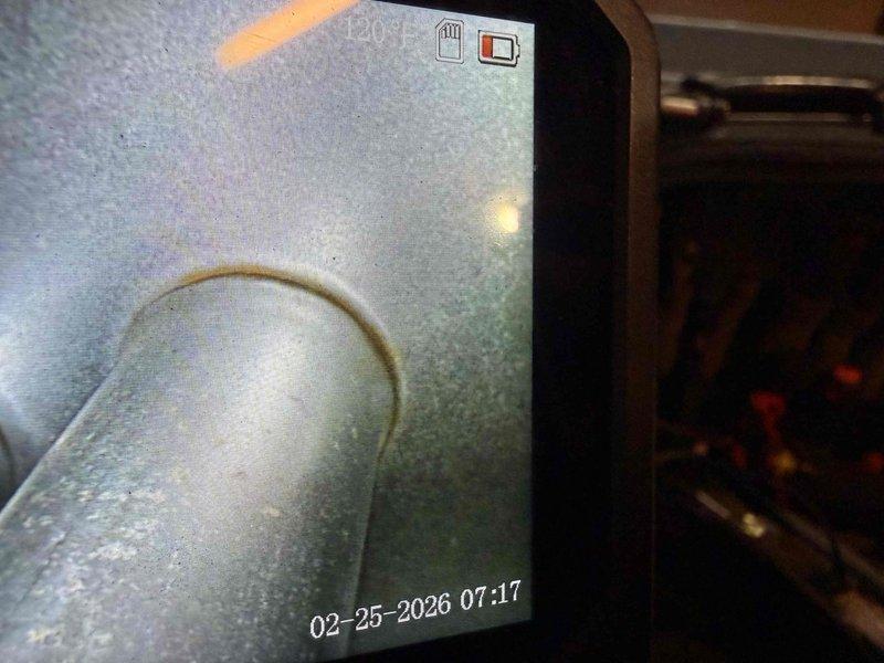 # Service Report

Responded to no-heat call for furnace system over 20 years old located in basement. Upon arrival, conducted diagnostic inspection to determine cause of unit failure to ignite. Performed visual assessment of furnace cabinet and internal components. Utilized inspection camera equipment to examine heat exchanger condition and internal combustion chamber areas, revealing significant deterioration and potential safety concerns typical of equipment exceeding expected service life. Documentation captured showing heat exchanger with visible wear patterns and compromised structural integrity at operating temperature of 120°F. Inspected flue piping, insulation, and venting system for proper configuration and clearances. Given the age of the equipment and observed condition of critical components, provided homeowner with findings regarding current system status and recommended replacement options to ensure safe and reliable heating operation. System remains non-operational pendi