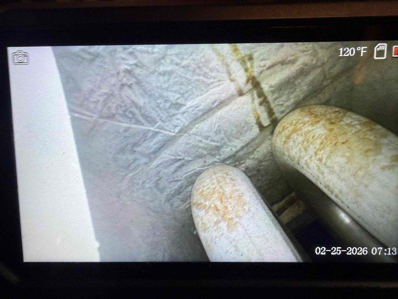 # Service Report

Responded to no-heat call for furnace system over 20 years old located in basement. Upon arrival, conducted diagnostic inspection to determine cause of unit failure to ignite. Performed visual assessment of furnace cabinet and internal components. Utilized inspection camera equipment to examine heat exchanger condition and internal combustion chamber areas, revealing significant deterioration and potential safety concerns typical of equipment exceeding expected service life. Documentation captured showing heat exchanger with visible wear patterns and compromised structural integrity at operating temperature of 120°F. Inspected flue piping, insulation, and venting system for proper configuration and clearances. Given the age of the equipment and observed condition of critical components, provided homeowner with findings regarding current system status and recommended replacement options to ensure safe and reliable heating operation. System remains non-operational pendi