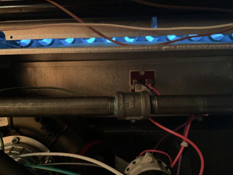 # Gold Furnace Inspection Service Report

Completed comprehensive Gold-level furnace inspection on a recently installed forced-air heating system located in basement. Unit is less than one year old and homeowner confirmed single-unit residential application.

Performed thorough operational assessment including visual inspection of burner assembly, heat exchanger, and ignition system. Observed burner flame pattern showing proper blue flames with even distribution across burner ports, indicating correct air-to-fuel mixture and proper combustion. Verified gas valve operation and manifold pressure within manufacturer specifications.

Inspected internal electrical components including control board wiring, safety switches, and limit controls. All wire connections examined for proper termination and secure mounting. Documented condition of flame sensor and removed for cleaning to ensure reliable ignition cycles. Flame sensor showed minimal carbon buildup consistent with new equipment operati