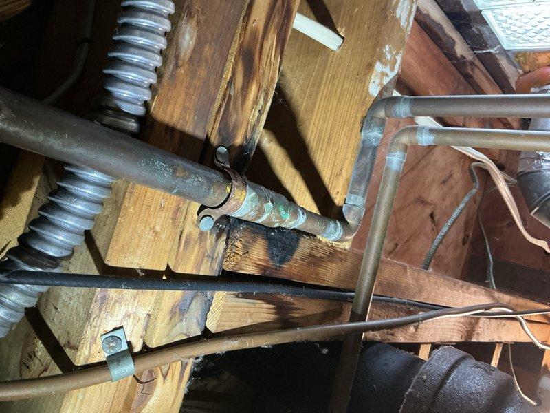 # Job Description

Successfully installed a 40-gallon standard capacity tanked water heater in the mechanical room. The installation included connecting copper supply lines, installing appropriate shut-off valves with identification tags, and routing metallic flexible venting through the existing ceiling structure to ensure proper exhaust ventilation. All plumbing connections were secured and tested, with the unit positioned on the concrete floor and properly integrated into the building's existing utility infrastructure.