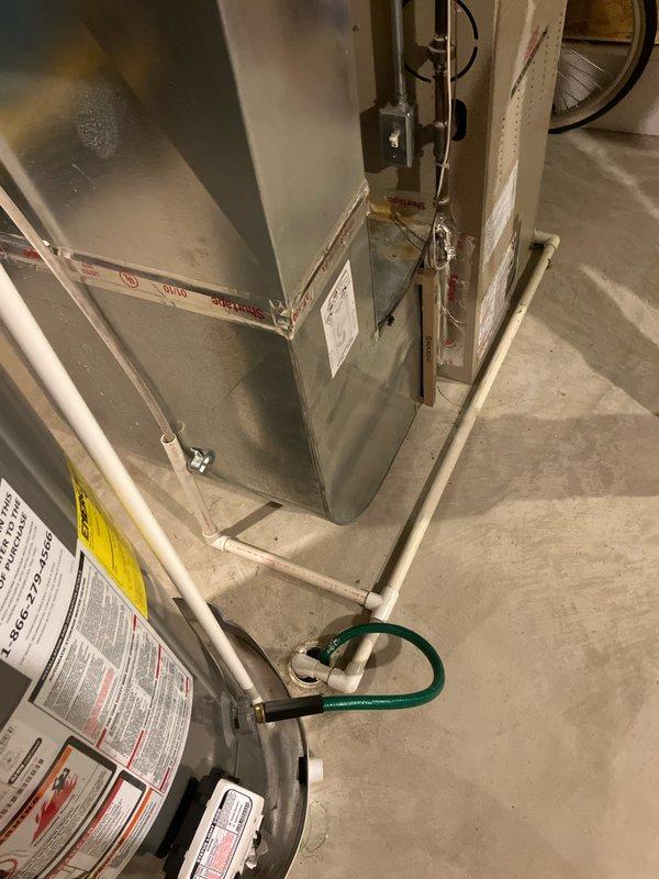 # HVAC Estimate - Replacement Summary

Performed on-site evaluation for complete furnace and air conditioning system replacement at residential property. Assessed existing 10+ year old natural gas furnace and AC system located in basement. Current equipment remains operational but customer inquired about available replacement options and promotional offerings. Documented existing system configuration including furnace, air handler, and condensate drainage setup with metal conduit and PVC drain lines. Photographed current equipment specifications, manufacturer labels, and installation layout to prepare comprehensive replacement estimate. Provided quote reference CQ 07617-02 for proposed new HVAC system installation.