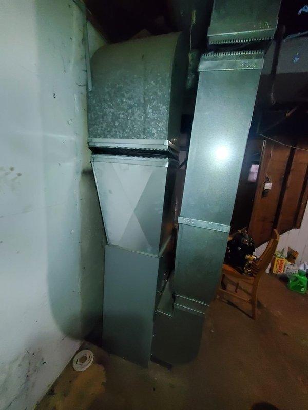 # Service Report: HVAC No Heat Call

Responded to no heat call for furnace located in basement with no power to unit. Upon inspection, diagnosed failed inducer motor preventing furnace operation. Inducer motor exhibited signs of wear and contamination with visible debris accumulation around housing and exhaust components. Verified motor failure as root cause of no heat condition. Ordered replacement inducer motor for installation. Unit will remain out of service until new motor arrives and is installed to restore proper furnace operation and heating capability.