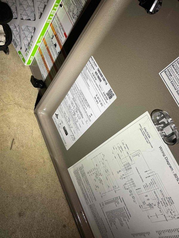 # HVAC Service Warranty Report

## Service Summary
Responded to no-heat complaint on 5-year-old furnace producing operational sounds without heat output. Diagnosed failed blower motor and completed replacement under warranty.

## Work Performed

Arrived on-site and confirmed homeowner complaint of furnace running without heat production. Conducted comprehensive diagnostic evaluation of basement-installed furnace system. Performed visual inspection of unit components and verified power supply to system.

Utilized digital multimeter to test electrical circuits and components. Measured voltage and continuity across heating elements and motor connections. Testing revealed blower motor failure as root cause of no-heat condition. Motor was receiving proper electrical supply but failed to operate, preventing air circulation through heat exchanger and resulting in no heat delivery to living spaces.

Documented equipment specifications and wiring configuration through photographic documentation
