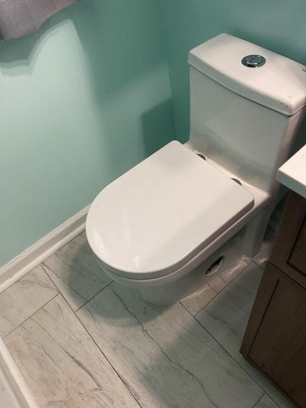 # Plumbing Service Report

Completed stack repair service in residential property. Replaced and reconfigured white PVC drain stack assembly in basement utility area, including multiple fittings and curved sections to ensure proper drainage flow. Connected flexible corrugated drain hose to new stack system and verified all connections were secure and leak-free. Work performed in area with existing PEX water lines and electrical infrastructure. All plumbing work completed to code specifications and system tested for proper operation.