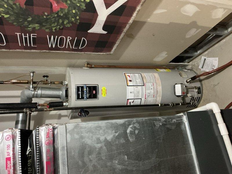 # Job Description

Successfully installed a new 50-gallon battery backup water heater system in the customer's utility room. The installation included complete connection of copper supply lines, gas line hookup, pressure relief valve installation, proper venting configuration, and secure mounting with metal strapping to ensure code compliance and safe operation. All plumbing connections were tested for leaks, the unit was fired up and verified operational, and the battery backup system was installed and tested to ensure continued hot water availability during power outages.