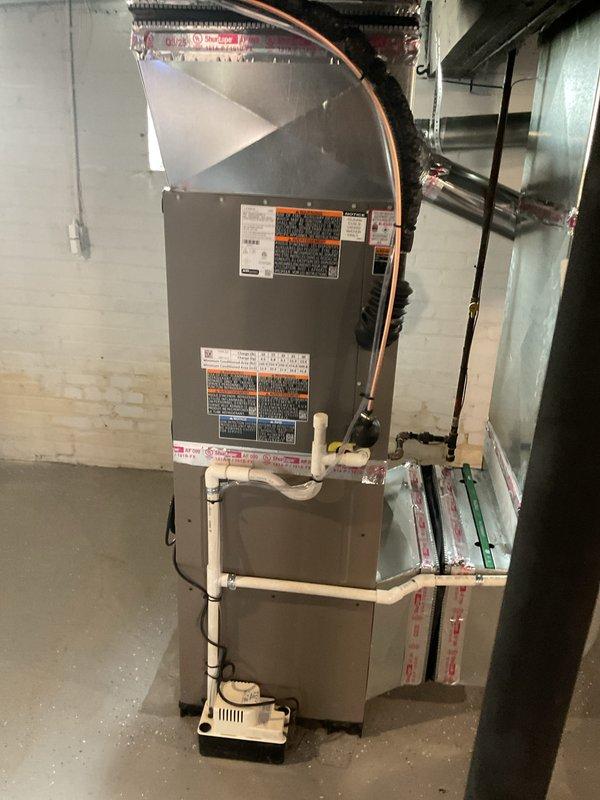 # HVAC Install - A/C & Coil Service Report

Successfully completed full-day installation of 2.5-ton air conditioning system with evaporator coil and furnace reinstallation in residential basement utility area. Installation included new copper refrigerant lines with proper insulation, white PVC condensate drainage system with pump, and coordination with electrician for new dedicated circuit as specified. All mechanical and electrical permits were requested and processed, with equipment properly positioned on concrete floor against concrete block walls, refrigerant lines routed to ceiling, and all connections secured per manufacturer specifications and code requirements.