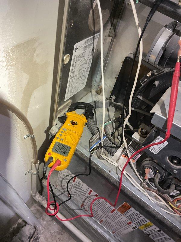 Performed complete tune-up and routine maintenance on a 10-year-old Bryant Evolution Plus 90i high-efficiency furnace located in interior closet. Conducted comprehensive system diagnostics using digital multimeter to verify electrical components, tested voltage and amperage at blower motor assembly and control board connections. Inspected all internal mechanical components, wiring connections, and safety controls for proper operation. Verified PVC condensate drain lines and venting systems clear and functioning correctly. System operating within manufacturer specifications with no issues found at time of service.