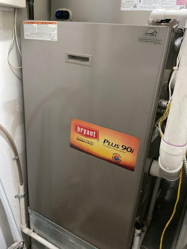 Performed complete tune-up and routine maintenance on a 10-year-old Bryant Evolution Plus 90i high-efficiency furnace located in interior closet. Conducted comprehensive system diagnostics using digital multimeter to verify electrical components, tested voltage and amperage at blower motor assembly and control board connections. Inspected all internal mechanical components, wiring connections, and safety controls for proper operation. Verified PVC condensate drain lines and venting systems clear and functioning correctly. System operating within manufacturer specifications with no issues found at time of service.