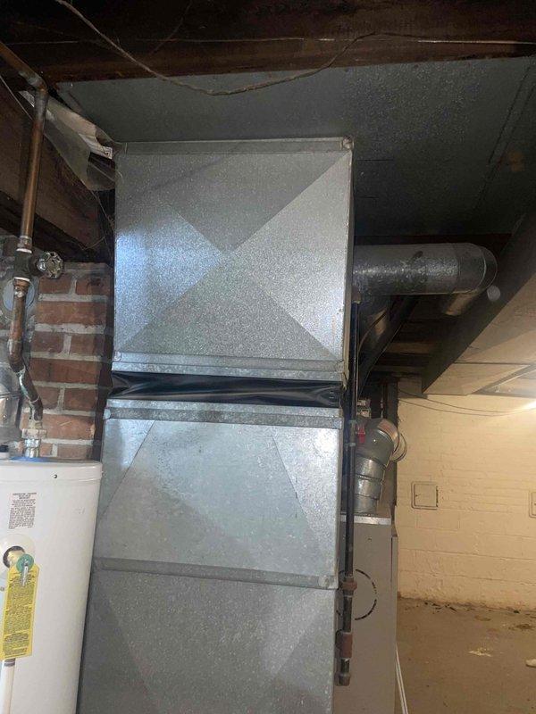 Conducted comprehensive assessment of two natural gas furnaces in basement of duplex property, both units over 10 years old. Identified cracked heat exchangers in both furnaces presenting safety hazard and preventing operation. Additionally diagnosed failed blower motor in one unit. Documented equipment conditions with photographic evidence showing basement installation with existing ductwork and HVAC infrastructure. Provided detailed replacement estimate for both furnace systems to restore safe heating operation to property.