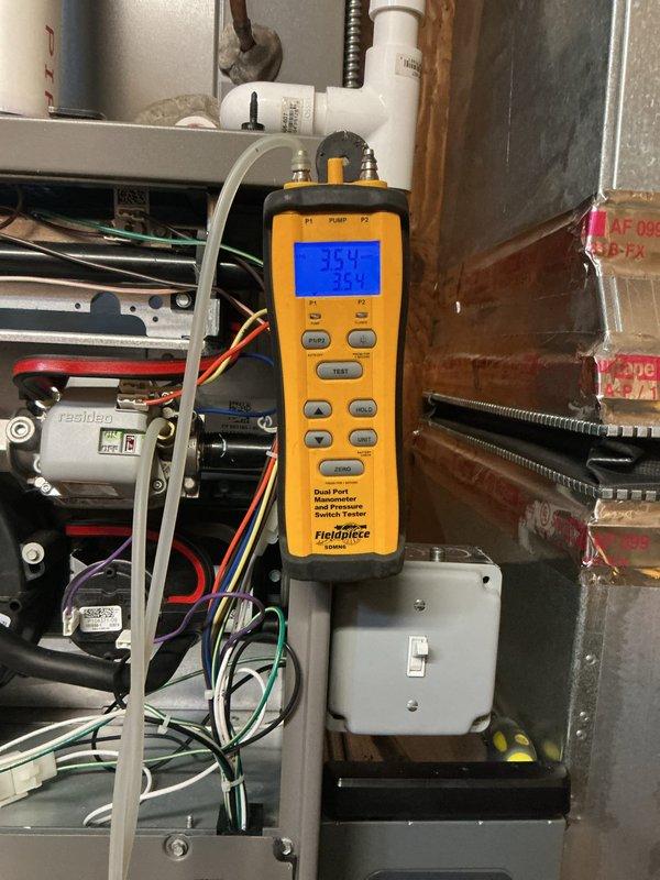 Responded to service call for 2-year-old furnace in basement experiencing intermittent shutdowns and displaying 5-blink error code. Upon arrival, furnace was operational. Performed comprehensive diagnostic testing using digital multimeter to check electrical components, including voltage readings at control board, safety circuits, and flame sensor connections. Tested pressure switches and verified proper operation of ignition system. Measured system pressures at 350 PSI to confirm adequate gas supply and proper combustion. Inspected all wire connections at control board and contactor, verifying secure terminations of red, black, white, and green conductors. Checked condensate drainage system and P-trap configuration for blockages that could trigger safety shutoff. The 5-blink error code typically indicates pressure switch or venting issues; verified all PVC vent pipes were clear and properly configured. System tested through multiple heating cycles with no faults detected. All electric