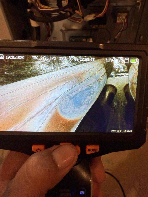 Responded to service call regarding excessive carbon monoxide detected at exterior furnace vent. Upon arrival, confirmed system was operational and heating properly with no gas detected inside living space. Performed comprehensive diagnostic inspection using digital camera equipment to examine internal ductwork, heat exchanger, and venting system for potential cracks, blockages, or combustion issues. Inspected Ameristar air handler unit, condensate pump assembly, PVC venting configuration, and all associated mechanical components. Verified proper operation of all safety controls and electrical connections.