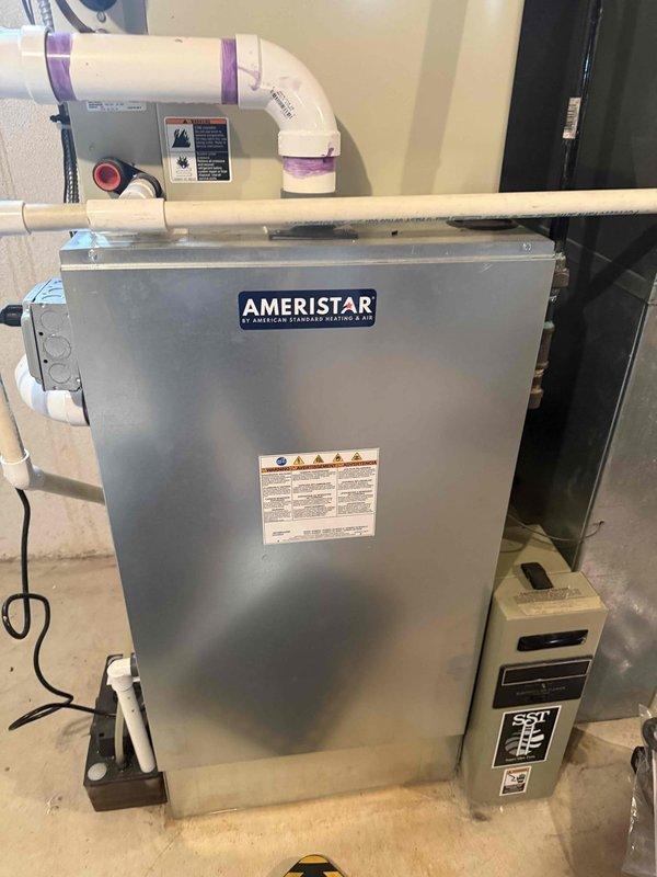 Responded to service call regarding excessive carbon monoxide detected at exterior furnace vent. Upon arrival, confirmed system was operational and heating properly with no gas detected inside living space. Performed comprehensive diagnostic inspection using digital camera equipment to examine internal ductwork, heat exchanger, and venting system for potential cracks, blockages, or combustion issues. Inspected Ameristar air handler unit, condensate pump assembly, PVC venting configuration, and all associated mechanical components. Verified proper operation of all safety controls and electrical connections.