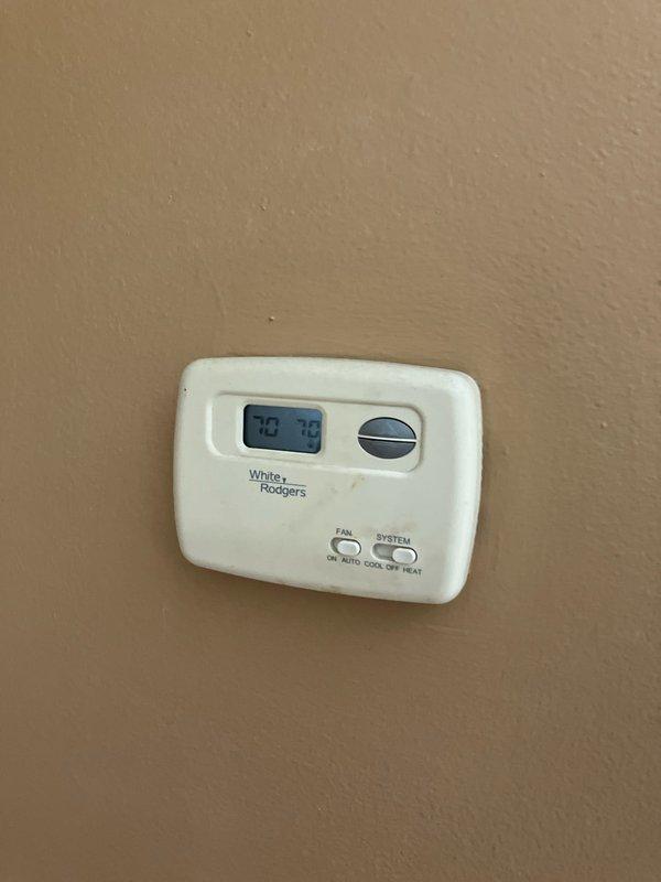 Conducted comprehensive on-site assessment for furnace replacement at residential property with 18-year-old heating system located in basement. Evaluated existing White-Rodgers thermostat, electrical service configuration including dual meter setup with exterior-mounted disconnect panel, and current HVAC infrastructure to provide detailed replacement estimate. Documented equipment specifications and site conditions through photographic records to support multiple quote options for new furnace installation.