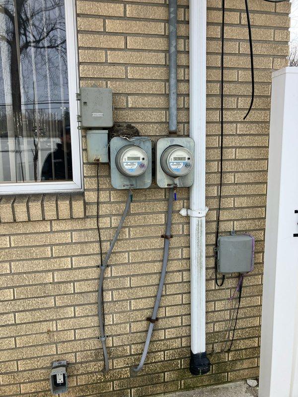 Conducted comprehensive on-site assessment for furnace replacement at residential property with 18-year-old heating system located in basement. Evaluated existing White-Rodgers thermostat, electrical service configuration including dual meter setup with exterior-mounted disconnect panel, and current HVAC infrastructure to provide detailed replacement estimate. Documented equipment specifications and site conditions through photographic records to support multiple quote options for new furnace installation.