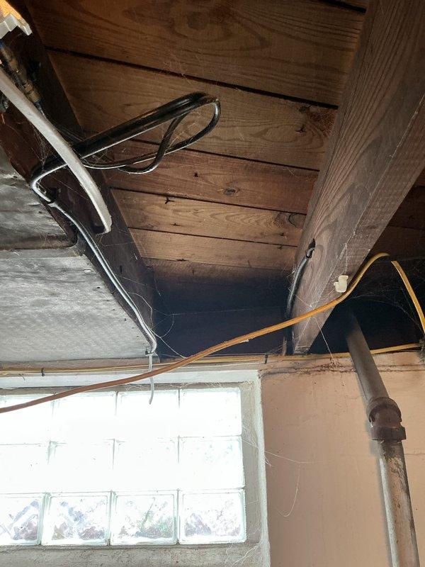 Completed furnace replacement estimate for a 15-year-old heating system experiencing multiple component failures. Upon inspection, identified blower motor seizing intermittently, inducer motor with active leak, burnt wiring on inducer assembly, and deteriorated humidifier pad requiring replacement. Unit located in basement with exposed ductwork and standard galvanized metal connections. Documented existing HVAC installation including vertical and horizontal duct transitions, copper piping, and overall system configuration. Provided comprehensive assessment of aging equipment and recommended replacement options due to cumulative component wear and intermittent operation affecting system reliability.