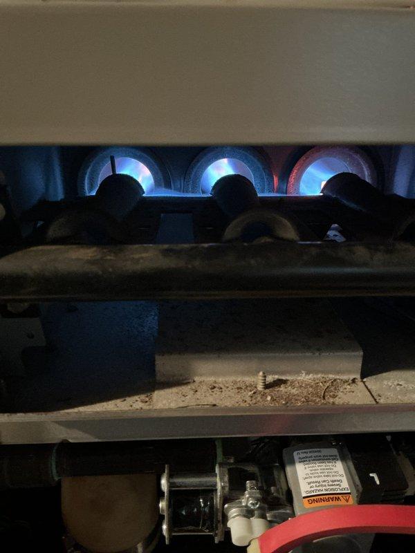 Returned to property to complete gas valve replacement on furnace system. Successfully installed new gas valve assembly and restored unit to proper operation. Verified ignition sequence, confirmed all three burners lighting properly with steady blue flames, and tested system for safe operation. Thermostat responding correctly with unit cycling as programmed.