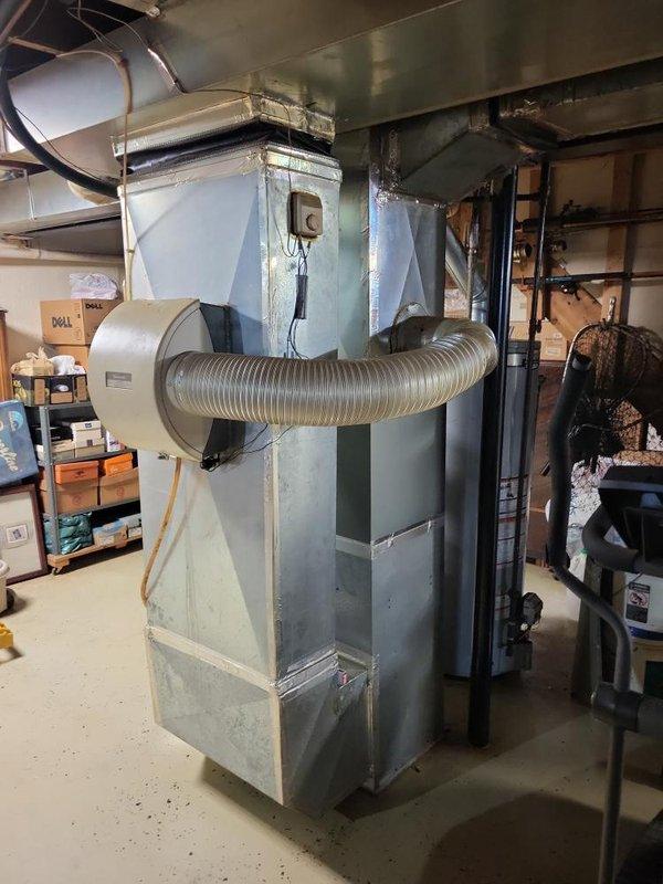 Completed comprehensive estimate for replacement of 30-year-old basement furnace unit showing signs of deterioration including inducer motor patched with silicone. Homeowner reported concerns regarding increased gas bills and indoor air quality issues related to smoke odors transferring through the HVAC system. Recommended installation of i-wave or APCO air purification system to address air quality concerns in addition to furnace replacement to improve efficiency and resolve safety issues with aging equipment.