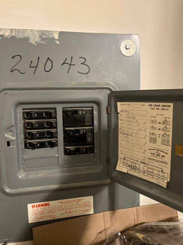 Completed diagnostic evaluation on 1996 furnace system located in condo unit near kitchen area presenting with humming noise complaint. Upon inspection, identified multiple critical failures including blower motor exhibiting rattling and grinding sounds with active oil leakage, inducer motor displaying faint rattling during startup cycle, and cracked heat exchanger with popped eyelet and visible fracture initiation. Noted heat exchanger had previous replacement performed in 2009. System accompanied by 2008 air conditioning unit. Provided comprehensive replacement estimate for furnace system due to severity of heat exchanger compromise and motor deterioration representing safety concern and end-of-life equipment condition.