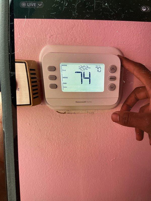 Responded to service call for newly installed furnace with blower continuously running after reaching set temperature. Upon arrival, verified thermostat was set to 74°F with current temperature at 70°F and system in AUTO mode. Inspected furnace control board and wiring connections. Diagnosed issue as improper thermostat configuration causing blower to run continuously in cooling mode rather than cycling with heat calls. Adjusted thermostat fan settings from continuous operation to AUTO mode to cycle with heating demand. Verified proper system operation with blower shutting off at temperature setpoint and cycling correctly with thermostat calls.