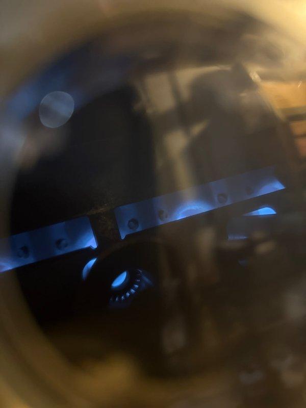 Completed comprehensive tune-up and safety inspection on furnace over 10 years old located in basement for city inspection compliance. Verified proper ignition sequence and burner flame characteristics, confirmed all gas connections secure with no leaks detected, and inspected heat exchanger for integrity. Tested all safety controls including limit switches and flame sensor, cleaned burner assembly, checked and adjusted gas pressure, and verified proper venting and combustion air supply. System operating safely and efficiently within manufacturer specifications; all components functioning properly with no immediate concerns noted.