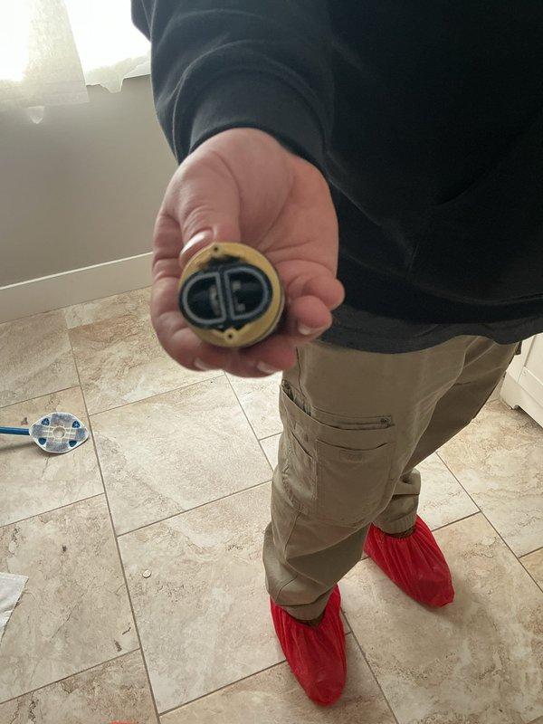 # Bathtub Drain Assembly Replacement

Responded to a bathroom drain issue that had been ongoing for 30 days in a 60-year-old residential property. Upon arrival, conducted a thorough inspection of the bathtub drainage system to identify the source of the clog and poor drainage performance.

## Work Performed

Removed the existing bathtub drain assembly, which showed significant age-related deterioration and corrosion consistent with the home's age. The original brass drain flange and internal components exhibited heavy buildup and wear that was impeding proper water flow. 

Created an access point in the bathroom wall to reach the drain assembly's connection points and associated plumbing. This wall opening allowed for proper removal and replacement of the corroded drain components that could not be accessed from the tub side alone.

Extracted the old drain flange, stopper mechanism, and associated hardware. The removed parts displayed extensive mineral deposits and corrosion that had a