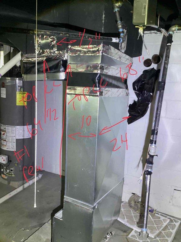 Conducted site assessment for two-family residential property requiring replacement of two stolen furnaces. Inspected existing HVAC infrastructure including air handler unit, ductwork connections, and supply/return configurations. Documented current equipment conditions, noting deteriorated insulation on plenum ductwork and existing PVC condensate drainage system, and photographed mechanical room layout with annotated measurements for equipment sizing and replacement planning.