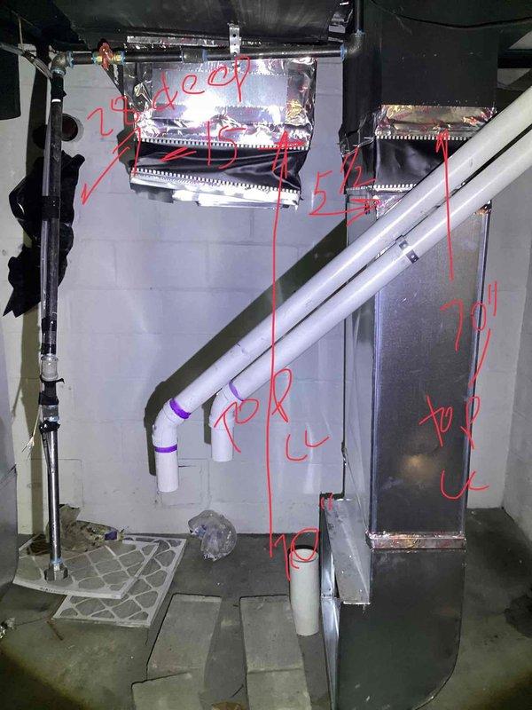 Conducted site assessment for two-family residential property requiring replacement of two stolen furnaces. Inspected existing HVAC infrastructure including air handler unit, ductwork connections, and supply/return configurations. Documented current equipment conditions, noting deteriorated insulation on plenum ductwork and existing PVC condensate drainage system, and photographed mechanical room layout with annotated measurements for equipment sizing and replacement planning.