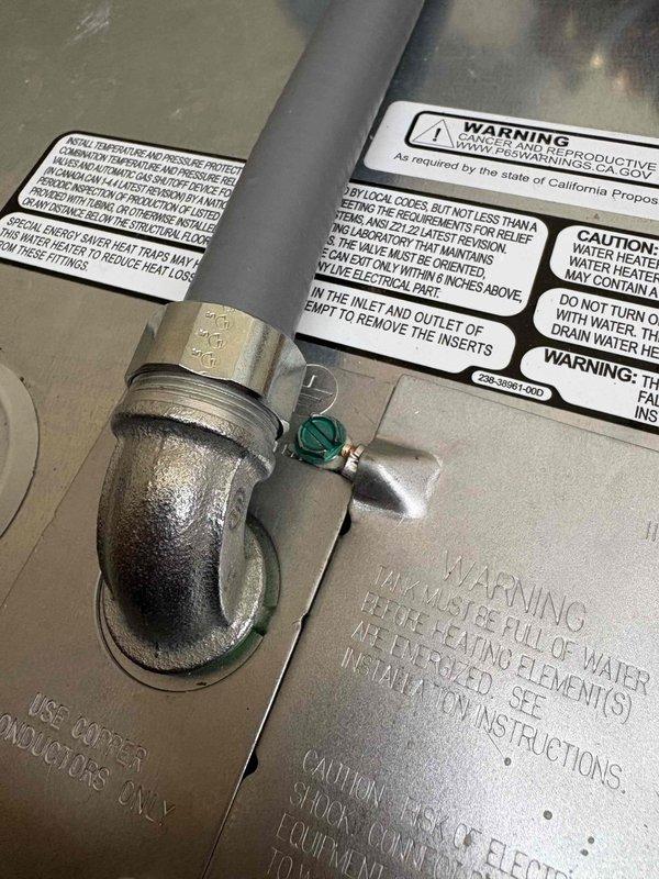 Responded to City of Royal Oak electrical code violation by installing proper protection for non-metallic cable and adding missing bushing to greenfield conduit termination. Corrected flexible metal conduit installation at ceiling junction point where greenfield was previously terminated without required insulated throat bushing, ensuring compliance with NEC requirements for conductor protection. All work completed to municipal code standards and documented with photographic evidence.