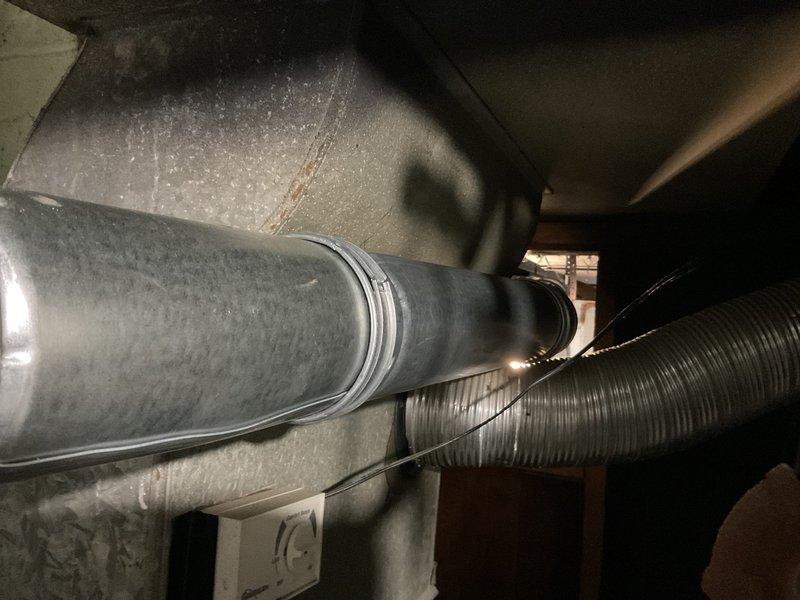 Completed installation and venting work for water heater using chimney liner system. Installed metallic ductwork including smooth rigid piping and corrugated flexible venting to properly exhaust combustion gases through existing chimney structure. Secured all ductwork with appropriate metal straps and hangers to ceiling joists, ensuring proper support and code-compliant clearances. Verified proper draft and ventilation for safe water heater operation.