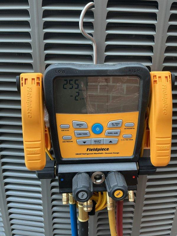 Completed full HVAC system installation including a 70,000 BTU furnace, 2.5-ton rear-discharge air conditioning unit, humidifier, and hot water heater. Installed S40 thermostat, performed all necessary mechanical and electrical connections, and reconnected existing equipment. Applied for mechanical and electrical permits prior to installation. Added condensate pump, installed chimney liner for proper venting, and completed all refrigerant line connections. Performed vacuum test and pressure checks using digital manifold gauges to verify system integrity and proper refrigerant charge. System tested and operational, qualifying for utility rebate program with AHRI certificate number 215663885.