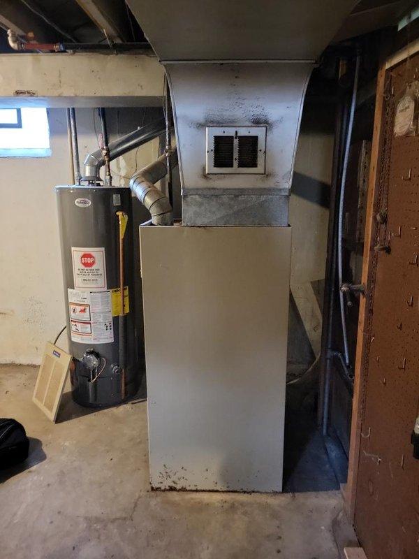 Provided estimate for new air conditioning system installation in basement location. Assessed existing mechanical room configuration with current furnace and water heater setup to determine proper placement and ductwork requirements for AC unit addition. Documented equipment layout and available space for new installation.