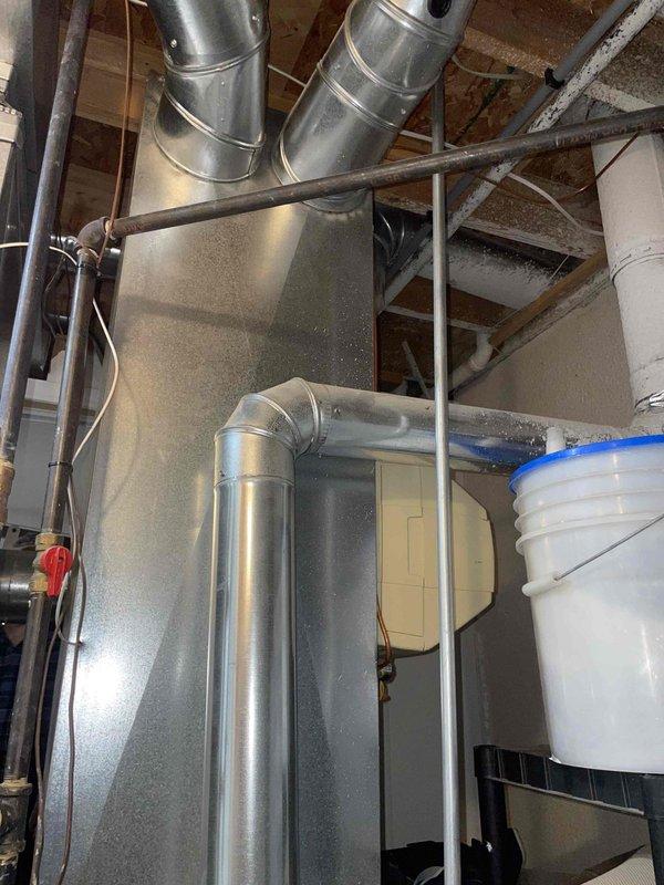 Provided comprehensive estimate for complete HVAC system replacement in basement location. Existing 30-year-old heating and air conditioning equipment has reached end of service life and requires full replacement including furnace, air conditioning unit, and associated ductwork connections. Documented current system configuration including galvanized ductwork, air handler cabinet, and mechanical room layout to ensure accurate equipment sizing and installation planning for replacement system.