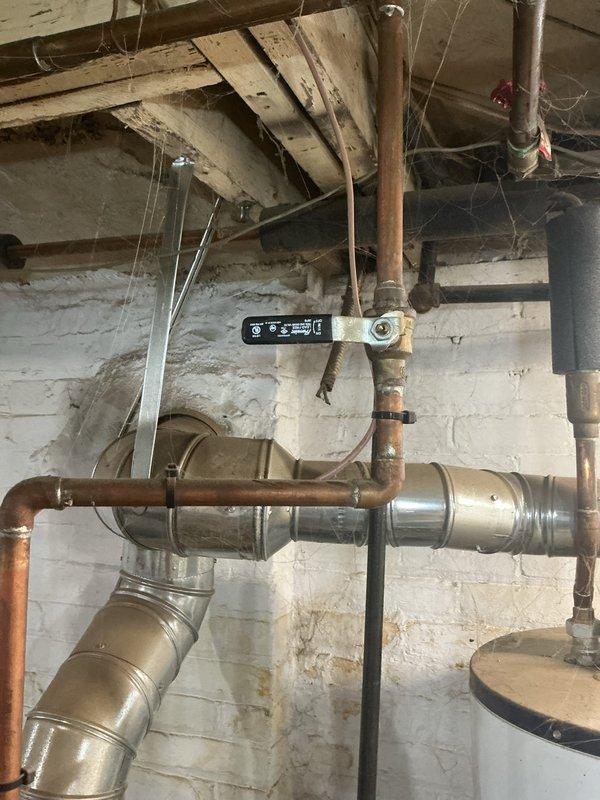 Responded to service call for leaking radiator in back room connected to 10-year-old steam boiler system located in basement. Performed diagnostic inspection of steam distribution system, identifying leak source at radiator connection point. Inspected boiler control board, pressure relief components, and steam piping infrastructure for proper operation and potential contributing factors to the leak condition.