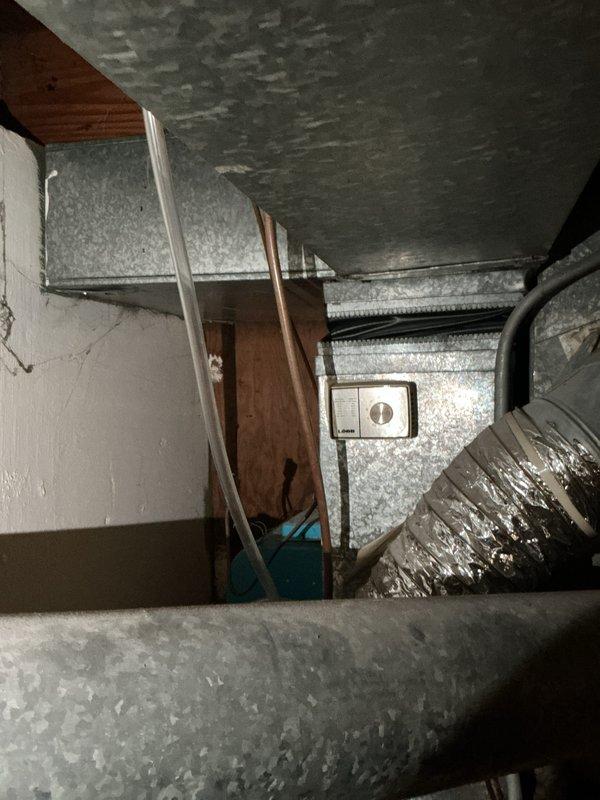 Completed furnace replacement estimate for city rental certification on aging heating system located in basement. Unit over 10 years old barely passed inspection requirements and was deemed safe to operate but nearing end of service life. Comprehensive assessment included evaluation of existing ductwork infrastructure with insulated metal ducts and support systems, inspection of humidifier operation, thermostat functionality, and hot water tank condition. Documented current equipment condition showing age-related wear, dust accumulation, and surface discoloration on cabinet housing and duct connections. Evaluated rigid and flexible ductwork connections, assessed insulation integrity throughout system, and verified proper support bracket installation. Provided replacement recommendations and specifications to bring system up to current efficiency standards and ensure continued safe operation for rental property compliance.