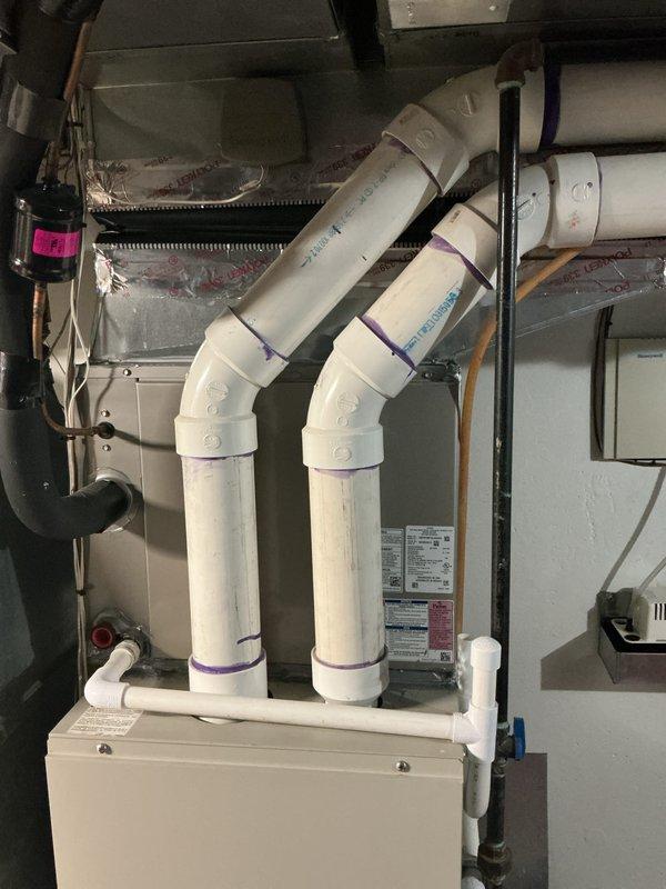 Responded to no-heat complaint on 20-year-old furnace system located in basement. Diagnostic evaluation revealed failed blower motor and inducer motor, with blower motor determined to be obsolete and no longer available for replacement. Due to age of equipment and unavailability of critical components, provided estimate for complete furnace replacement system. Also scheduled tankless water heater descaling service, though flushing procedure was deferred to subsequent appointment due to scheduling constraints.