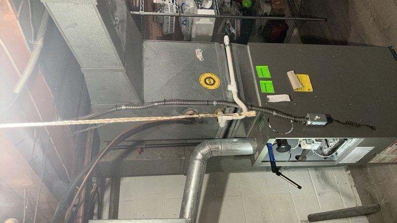 Completed comprehensive tune-up and safety inspection on 14-year-old gas furnace located in basement mechanical room. Performed full system diagnostics including heat exchanger inspection, burner assembly cleaning, ignition system testing, and blower motor lubrication. Verified proper operation of all safety controls, checked gas pressure and combustion efficiency, replaced air filter, and inspected ductwork connections for proper sealing.