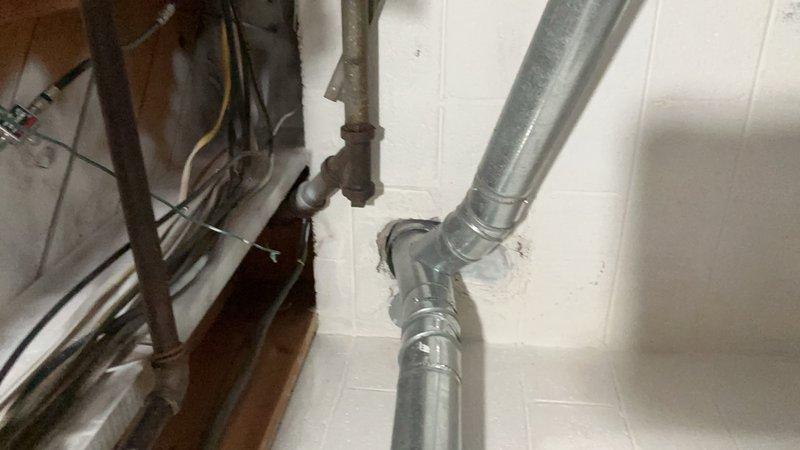 Completed comprehensive tune-up and safety inspection on 14-year-old gas furnace located in basement mechanical room. Performed full system diagnostics including heat exchanger inspection, burner assembly cleaning, ignition system testing, and blower motor lubrication. Verified proper operation of all safety controls, checked gas pressure and combustion efficiency, replaced air filter, and inspected ductwork connections for proper sealing.